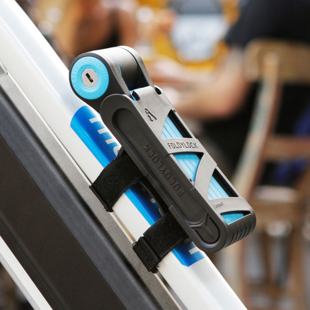 FoldyLock - Mini candado plegable para bicicleta – Candado ligero patentado  – Resistente antirrobo inteligente seguro con llave y funda para scooter